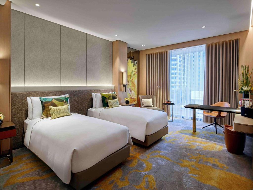 Sofitel Singapore City Centre客房内的一张或多张床位