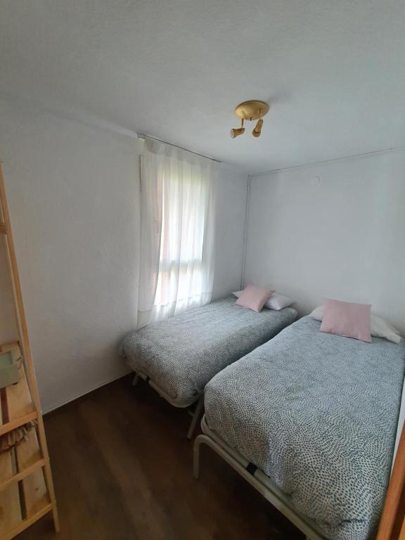 Postel nebo postele na pokoji v ubytování Rincón de Cerler