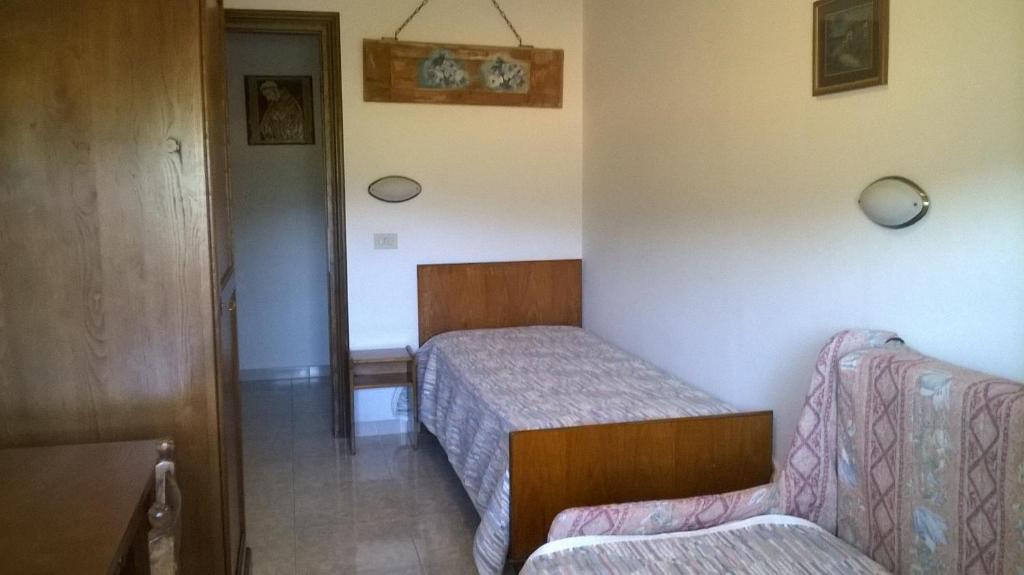 Postel nebo postele na pokoji v ubytování Agriturismo La Cantina VIA CAMPIGLIONE DI ASSISI