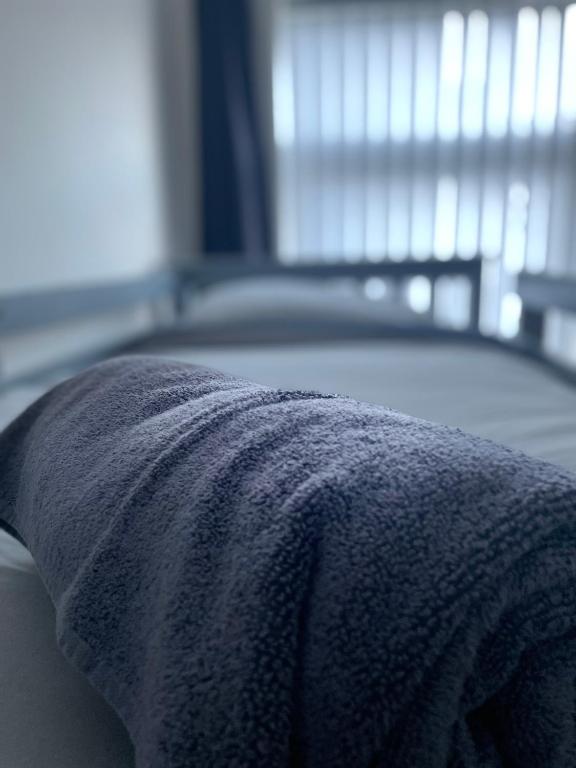 Postel nebo postele na pokoji v ubytování Dinorwic Lodge