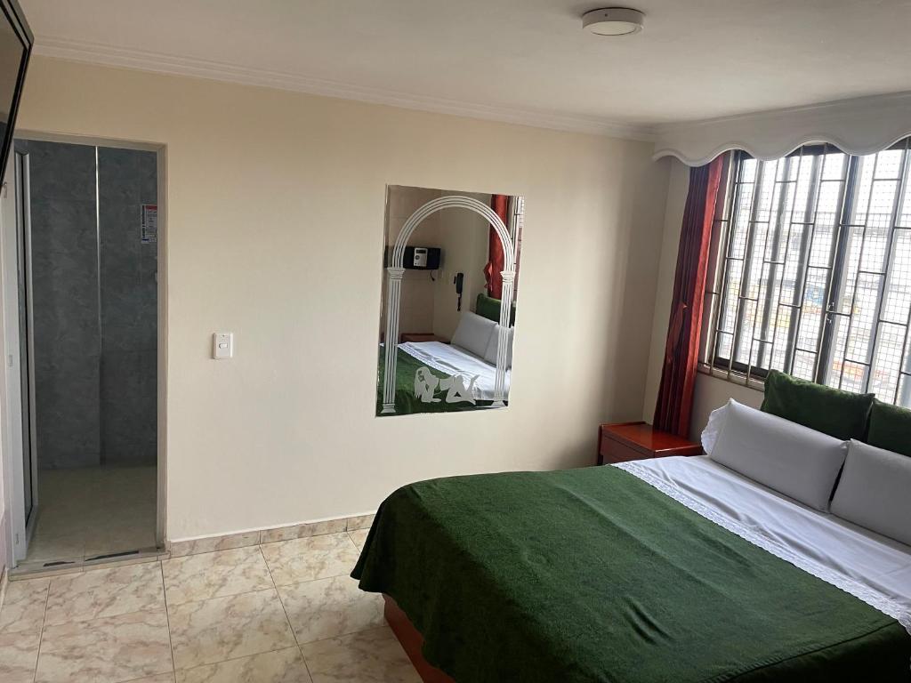 Postel nebo postele na pokoji v ubytování Hotel Brisas Real