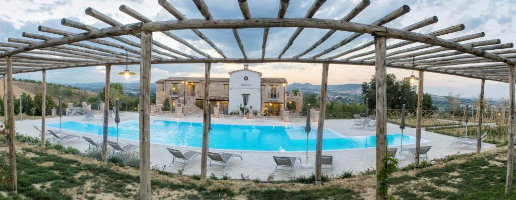 a large swimming pool in front of a building at Villa Sant'Angelo in Alba Adriatica