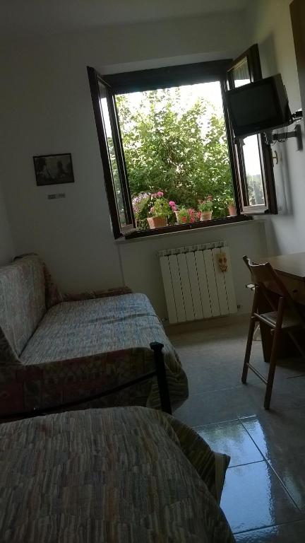 Postel nebo postele na pokoji v ubytování Agriturismo La Cantina VIA CAMPIGLIONE DI ASSISI