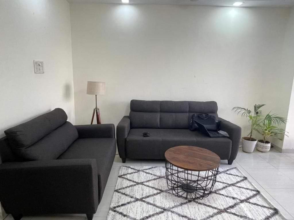 a living room with a couch and a coffee table at Bandra west 2bhk in Mumbai
