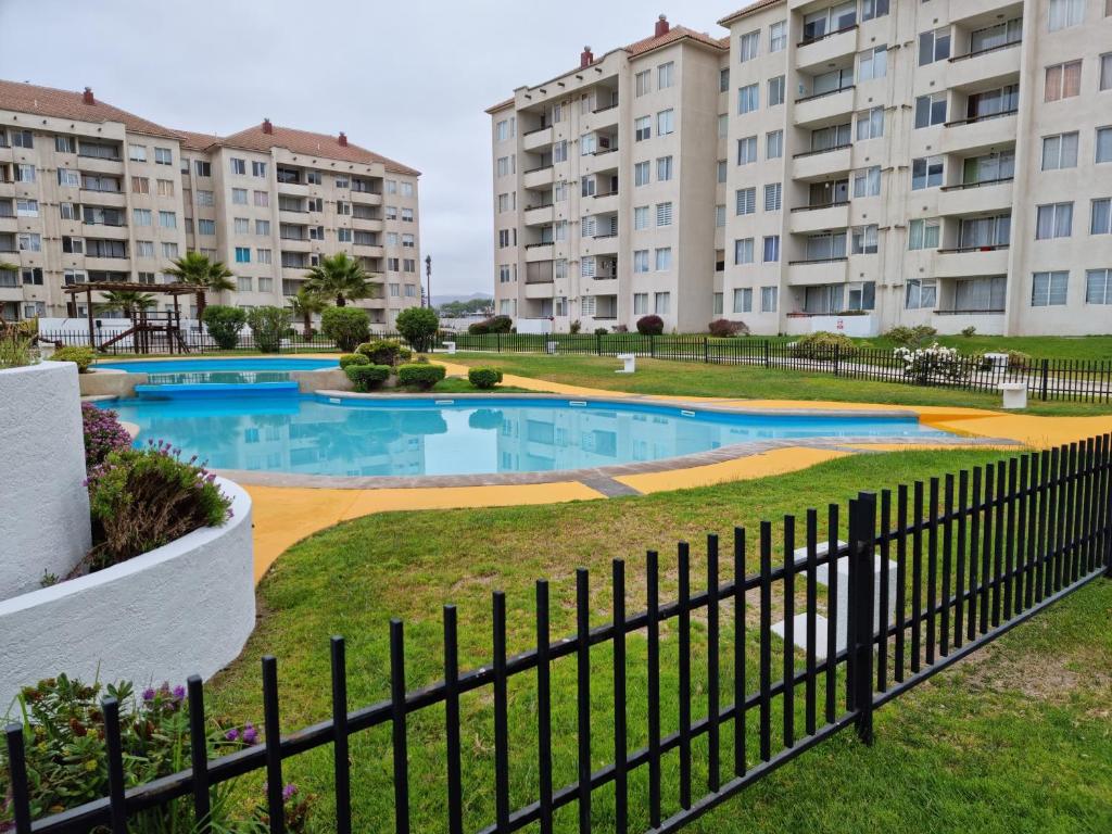 an image of an apartment complex with a swimming pool at Arriendo dpto avenida del Mar. in La Serena
