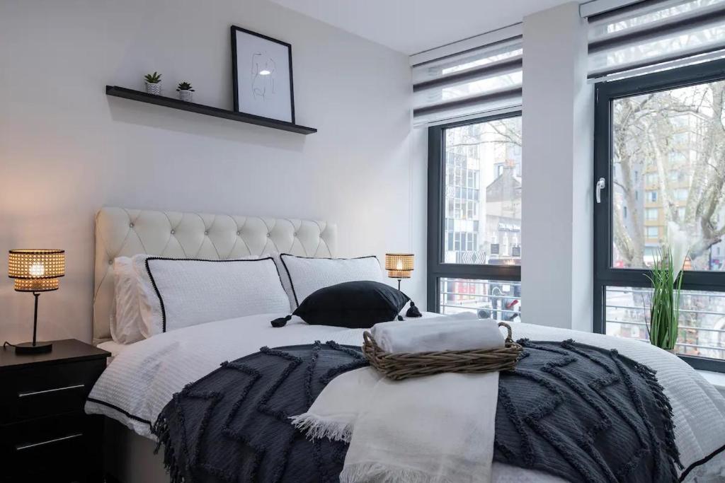 a bedroom with a large bed with pillows on it at Chapel House in London