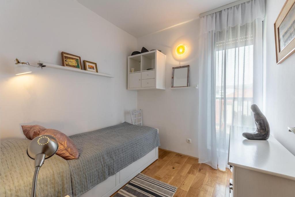 Posteľ alebo postele v izbe v ubytovaní Apartment Zenko