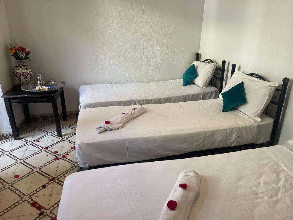 Postel nebo postele na pokoji v ubytování HOTEL EL AMAL