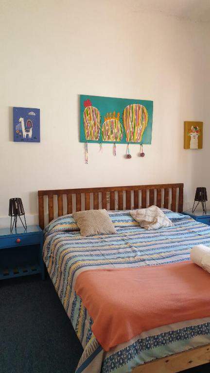 Ένα ή περισσότερα κρεβάτια σε δωμάτιο στο Hospedaje Los Cardones