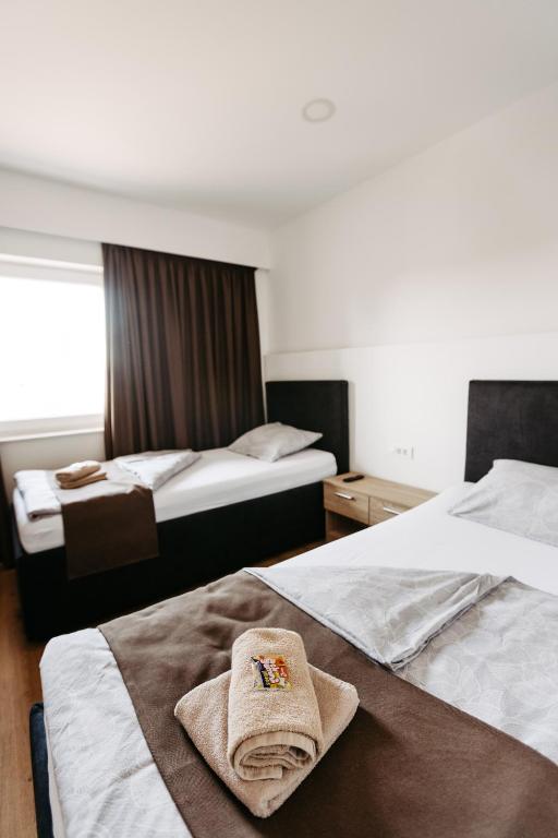 Katil atau katil-katil dalam bilik di Hotel Murat