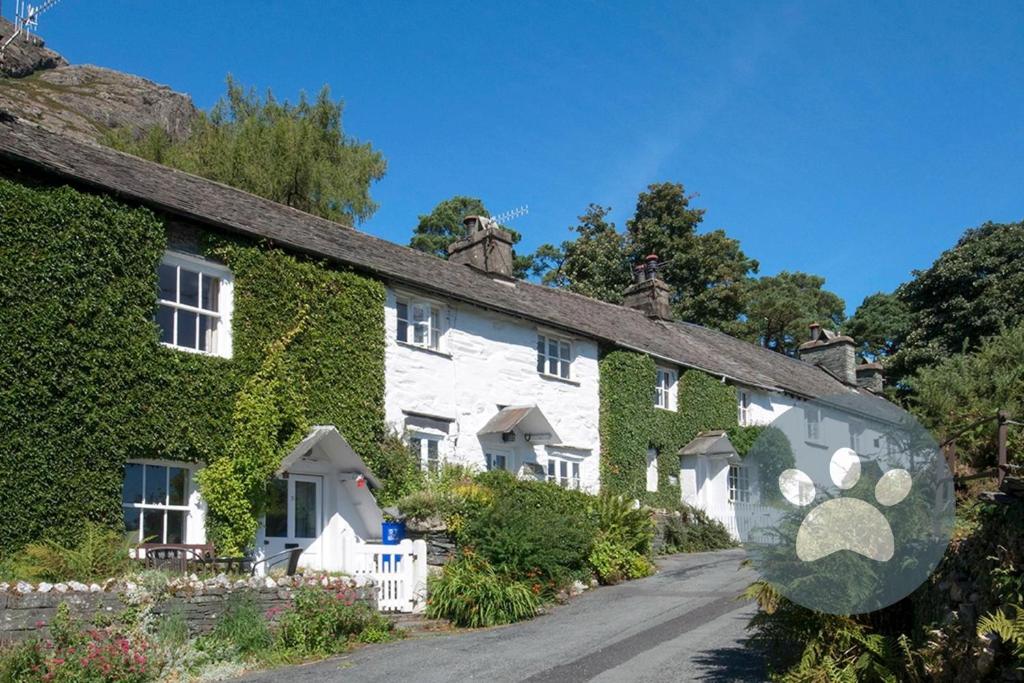 a row of houses covered in ivy at Crag Cottage in Coniston