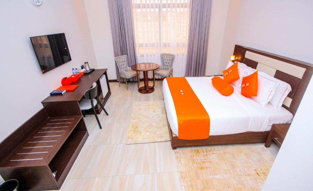 Postel nebo postele na pokoji v ubytování Lemaiyan Suites