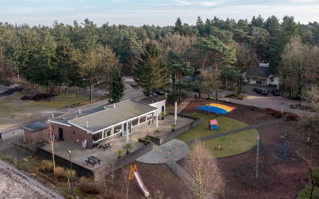 an aerial view of a park with a building at Prachtig chalet in de bossen in Nunspeet