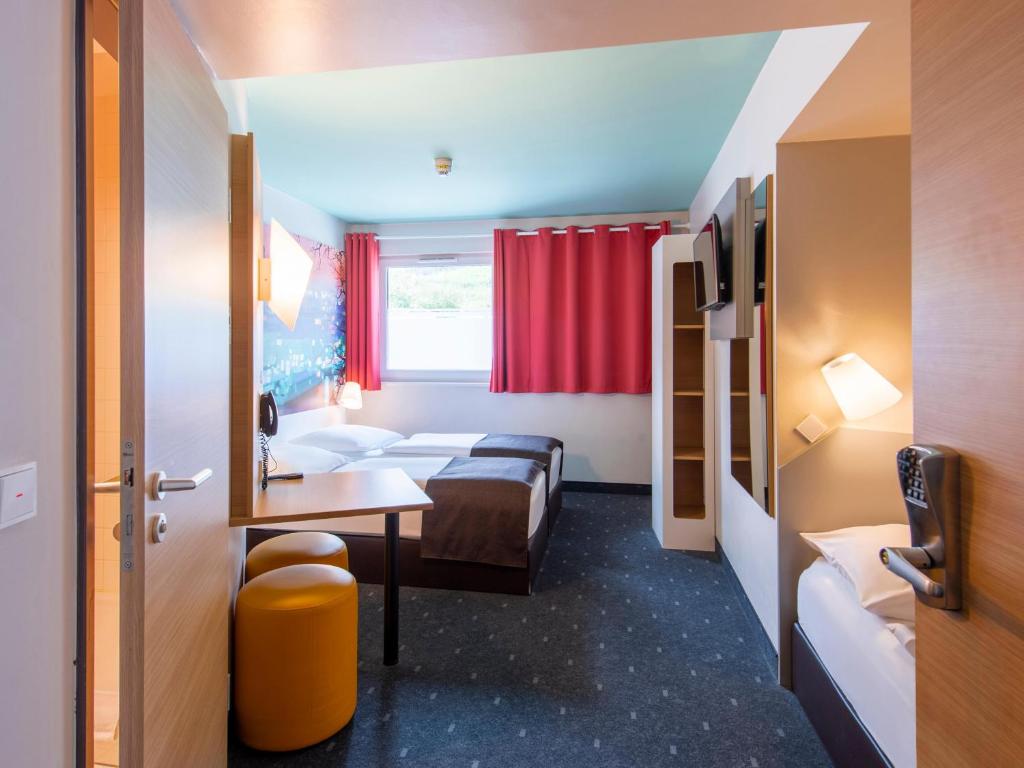 Postel nebo postele na pokoji v ubytování B&B Hotel Passau