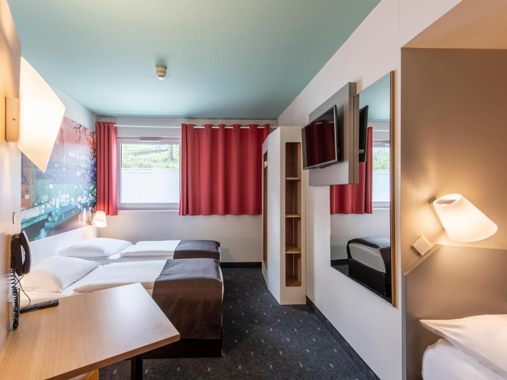 Postel nebo postele na pokoji v ubytování B&B Hotel Passau