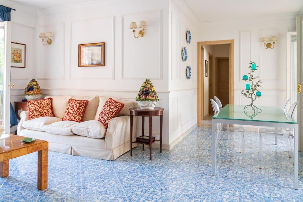 a living room with a couch and a table at Capri Lovers in Capri