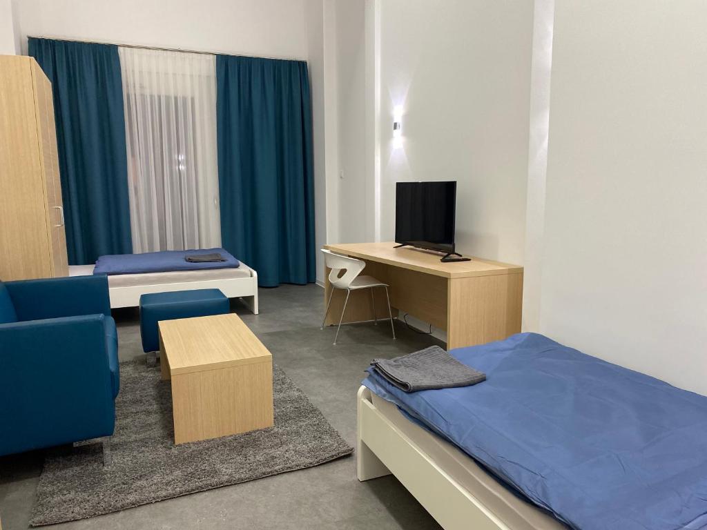 TV a/nebo společenská místnost v ubytování Fabella Flats Forchheim