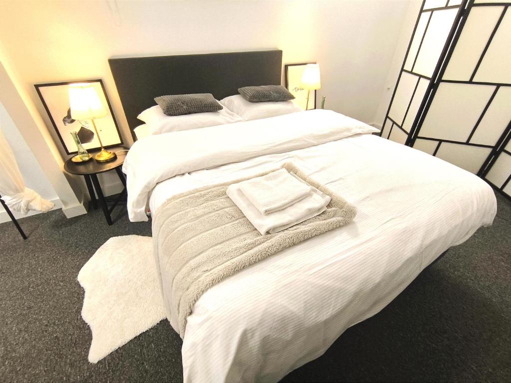 A bed or beds in a room at Park Bôrik 4YOU & Free Parking