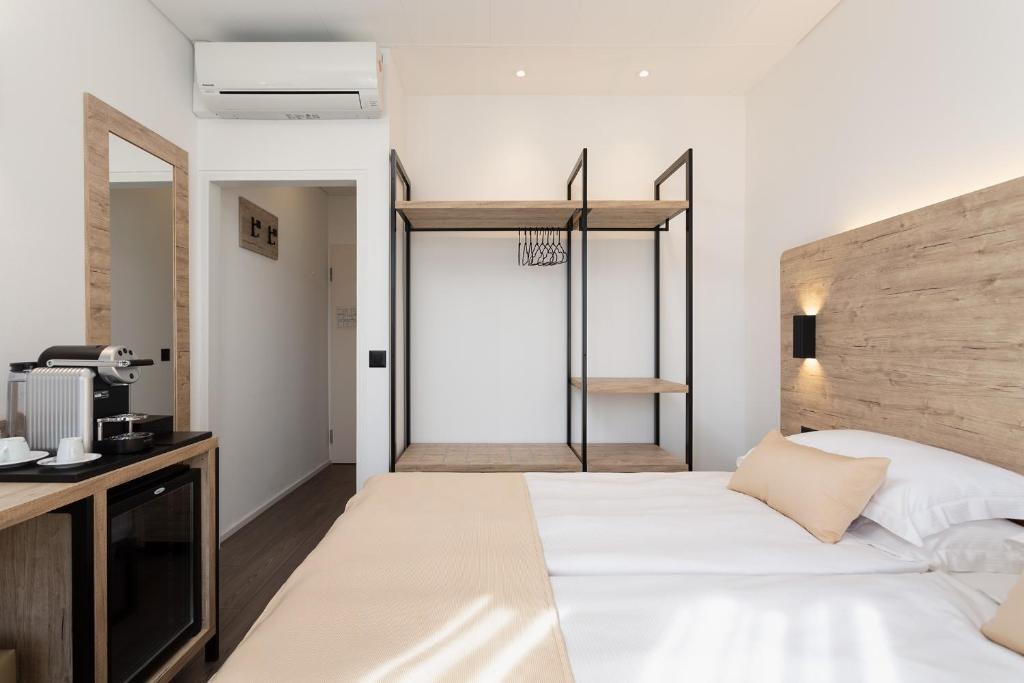 Postel nebo postele na pokoji v ubytování Hotel Du Lac