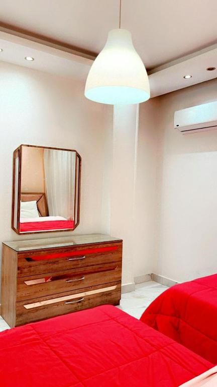 Postel nebo postele na pokoji v ubytování شارع جامعة الدول العربية - المهندسين