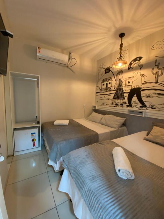 Llit o llits en una habitació de Hospedaria Valdice Damasceno Centro Histórico