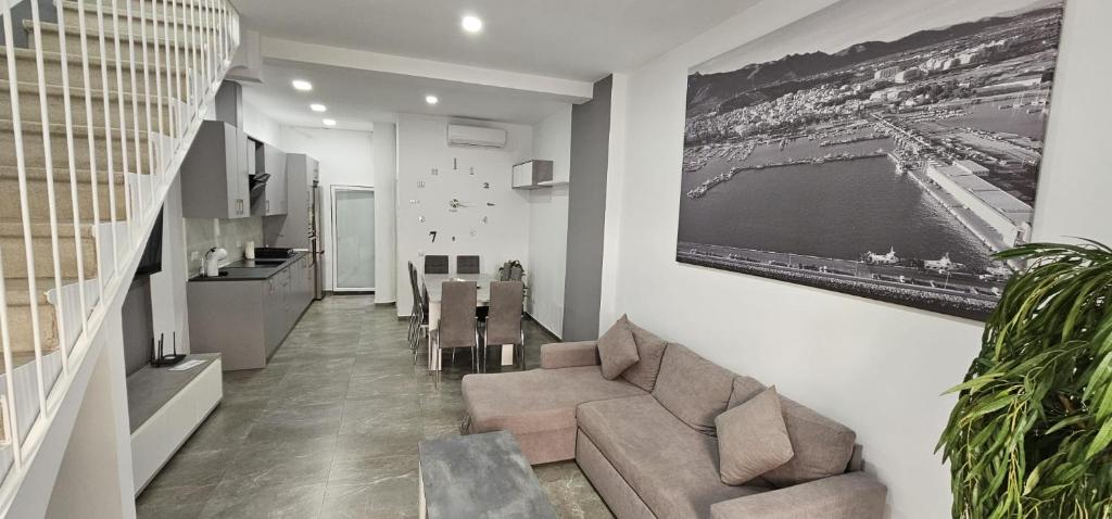 a living room with a couch and a table at Casa Elai in Sant Carles de la Ràpita