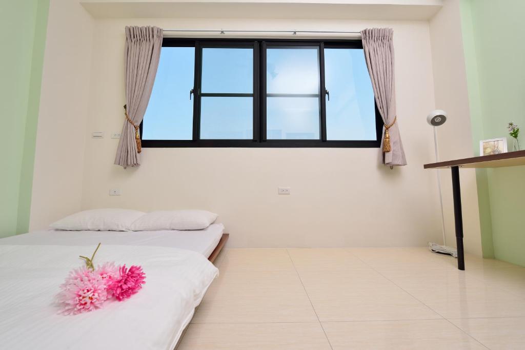 A bed or beds in a room at STSP Guest House