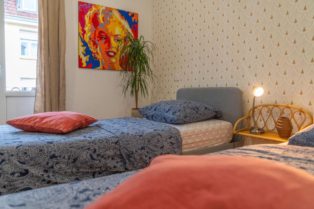 Plumeria - Grand 75m2 calme avec jardin Idéal familles et pros - 2 Chambres - 4 Lits séparés - Parking gratuit photo