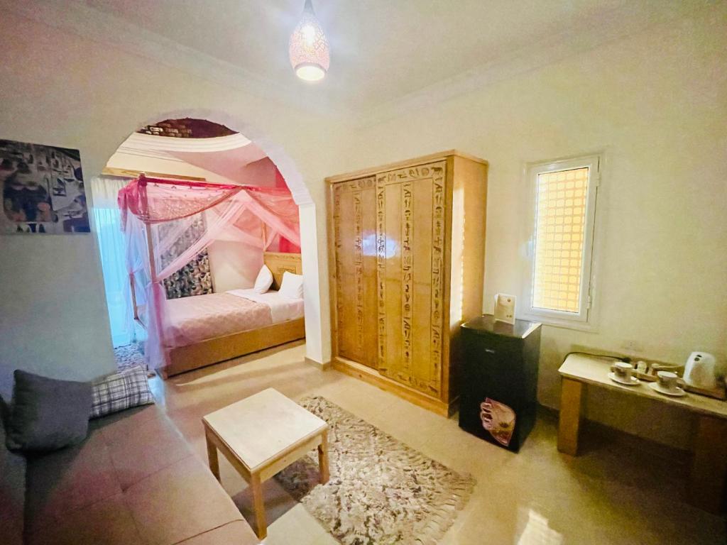 Postel nebo postele na pokoji v ubytování Jewel Howard Carter Hotel