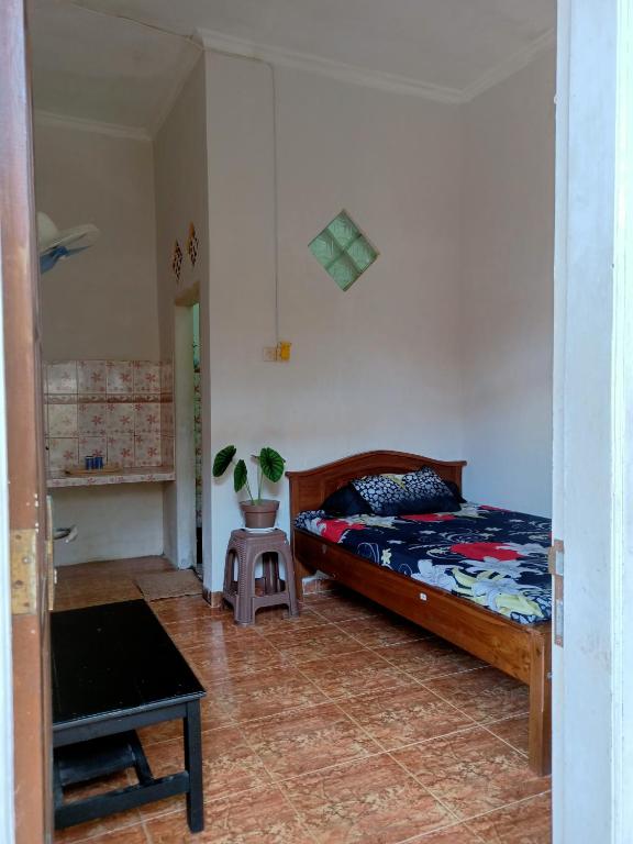 Postel nebo postele na pokoji v ubytování IjenBromo Hub Omyah Isun Hub
