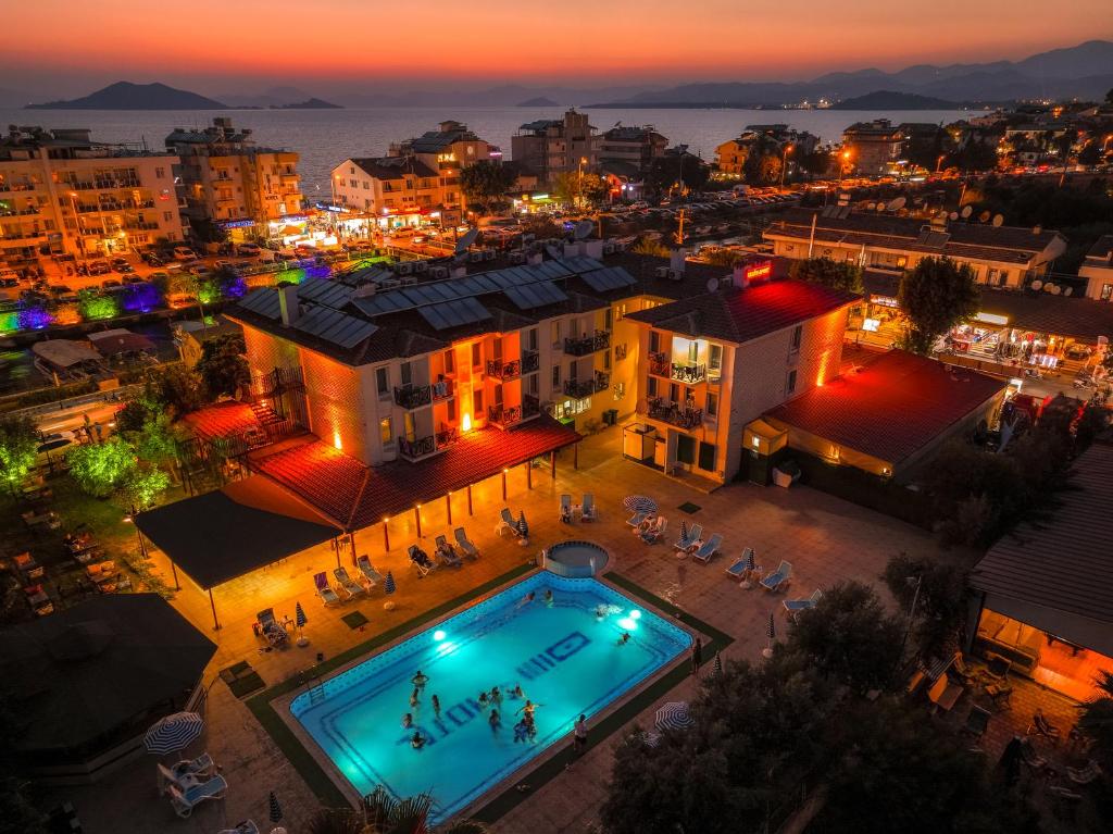 an overhead view of a pool in a city at night at Sunlight Otel Fethiye in Fethiye