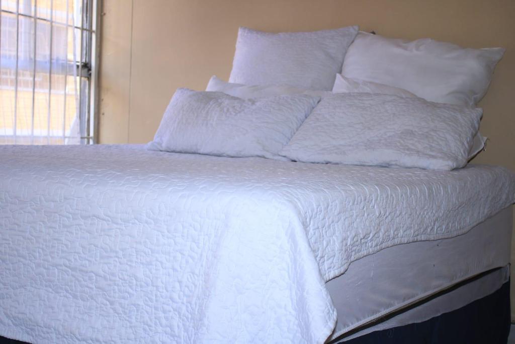 Ένα ή περισσότερα κρεβάτια σε δωμάτιο στο Executive affordable apartment