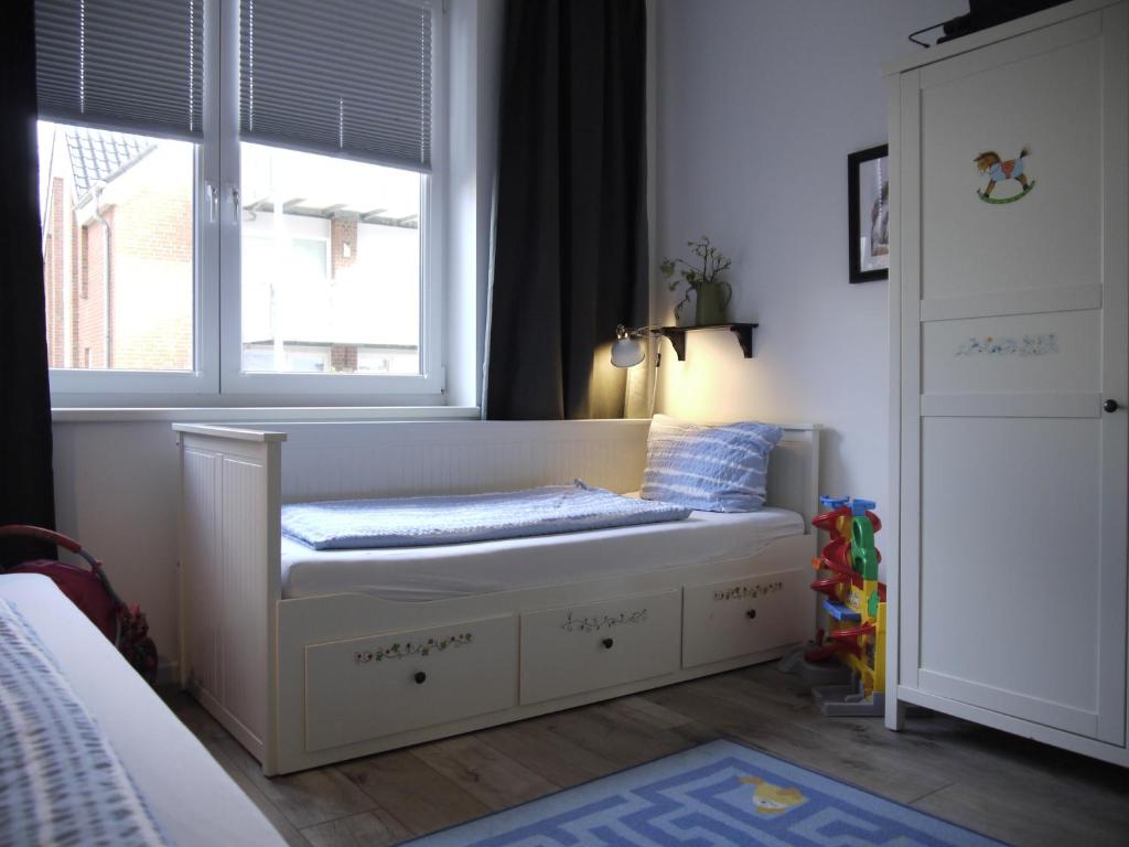 Postel nebo postele na pokoji v ubytování Strandperle 2