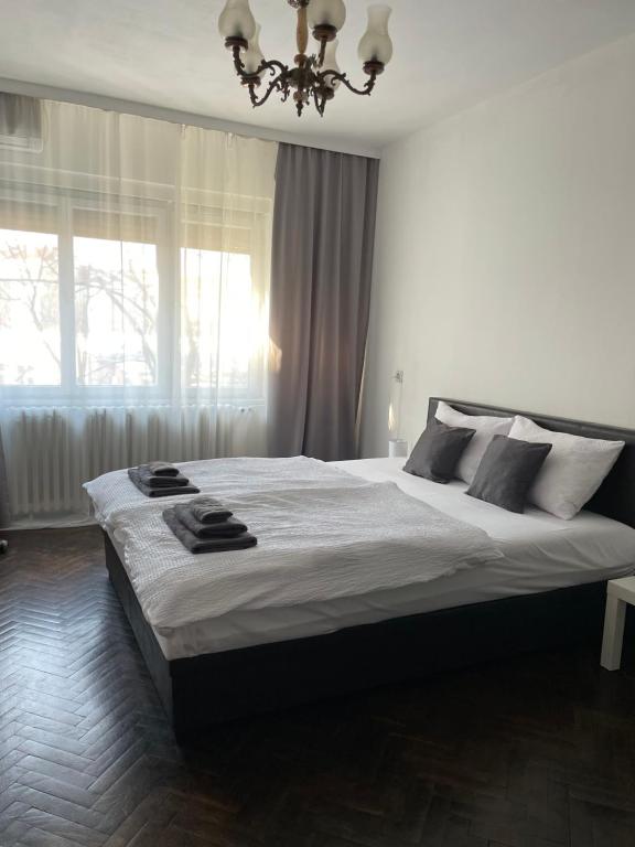 מיטה או מיטות בחדר ב-Apartman Lavanda