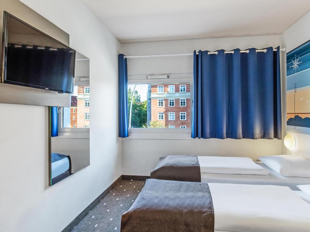 Postel nebo postele na pokoji v ubytování B&B Hotel Hamburg-Altona