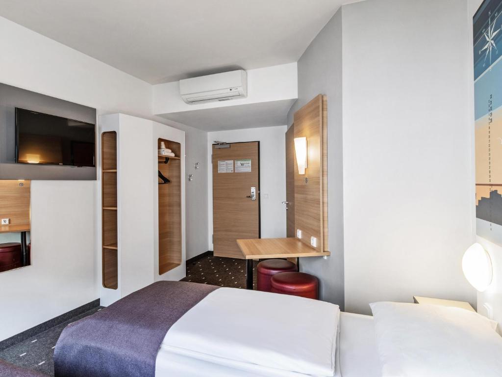 Postel nebo postele na pokoji v ubytování B&B Hotel Hamburg-Altona