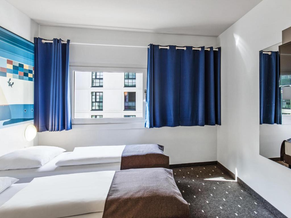 Postel nebo postele na pokoji v ubytování B&B Hotel Hamburg-Altona