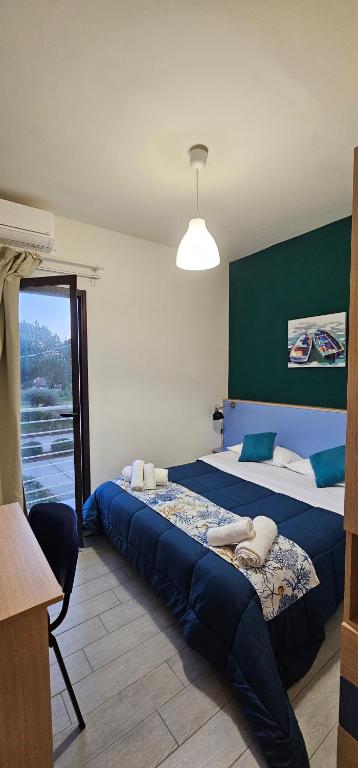 Postel nebo postele na pokoji v ubytování Giostemar Rooms - Playa Grande