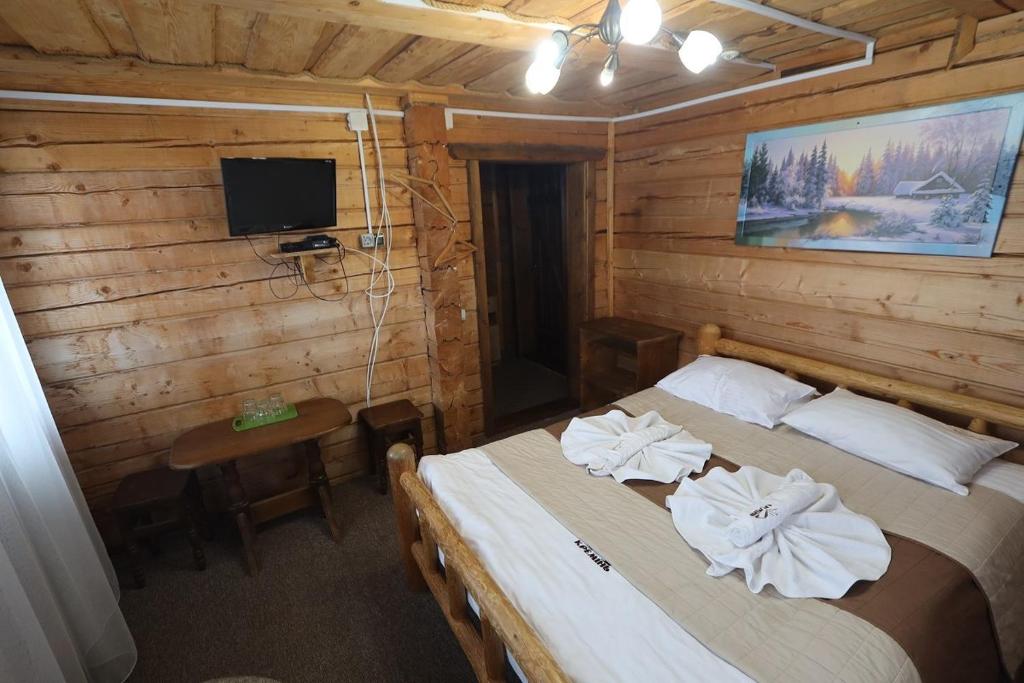 Postel nebo postele na pokoji v ubytování КРЕМІНЬ