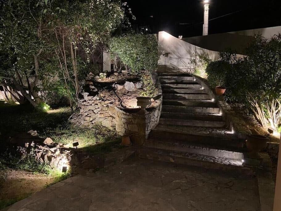 a set of stairs in a garden at night at Un paradis avec piscine au cœur du village in Cassis