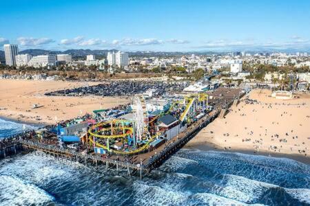 an aerial view of a beach with a roller coaster at 2 Santa Monica Beach Walking in Los Angeles