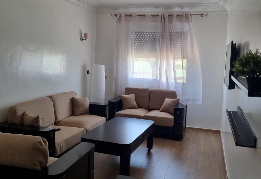 Χώρος καθιστικού στο Appartement propre et soigné