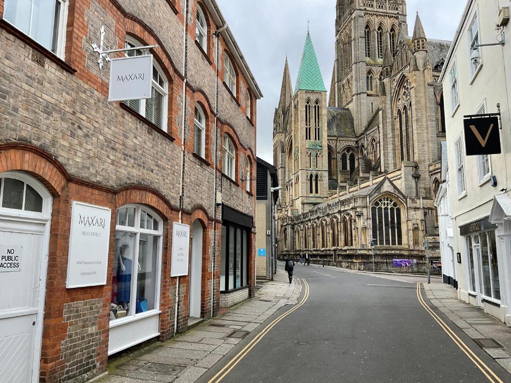 an empty street in front of a cathedral at Private Double Room with Ensuite, No Breakfast, Truro City Centre in Truro