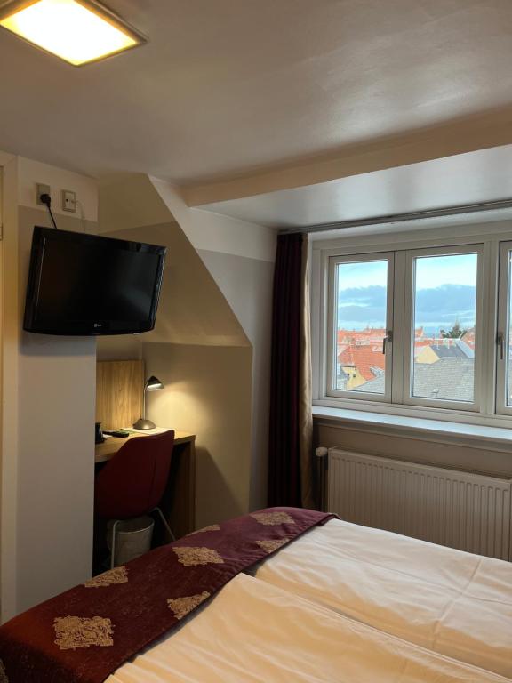 Postel nebo postele na pokoji v ubytování Hotel Skandia