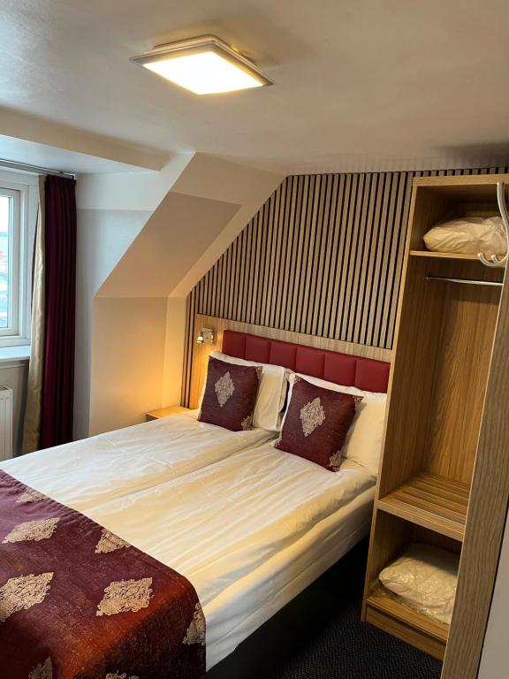 Postel nebo postele na pokoji v ubytování Hotel Skandia