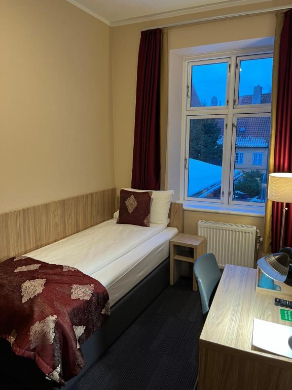 Postel nebo postele na pokoji v ubytování Hotel Skandia