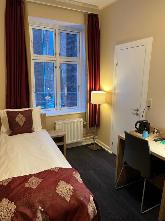 Postel nebo postele na pokoji v ubytování Hotel Skandia