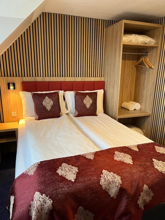 Postel nebo postele na pokoji v ubytování Hotel Skandia