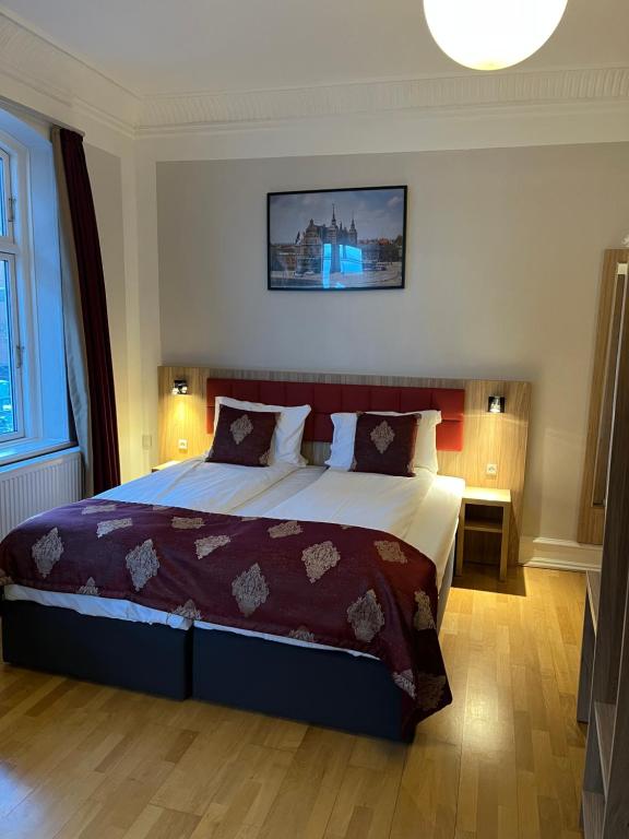 Postel nebo postele na pokoji v ubytování Hotel Skandia
