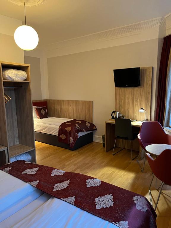 Postel nebo postele na pokoji v ubytování Hotel Skandia